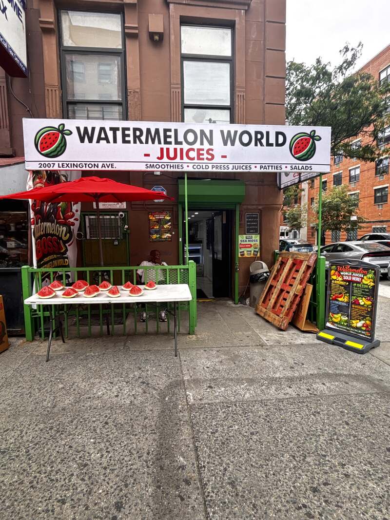 The Watermelon World Juices storefront at 2007 Lexington Ave, with its red umbrella and green railing